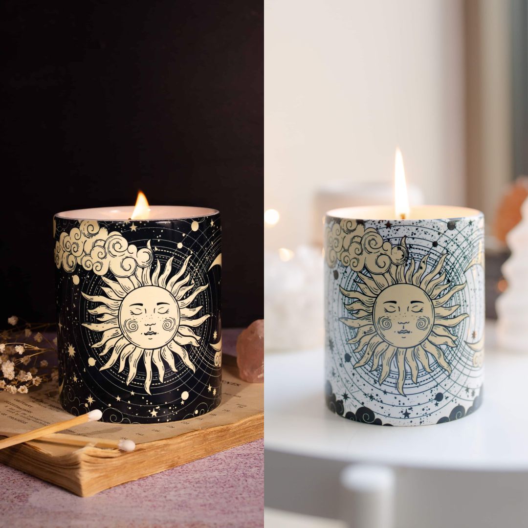 Two one wick candles in designed ceramic vessels featuring a mystic sun in the front and stars